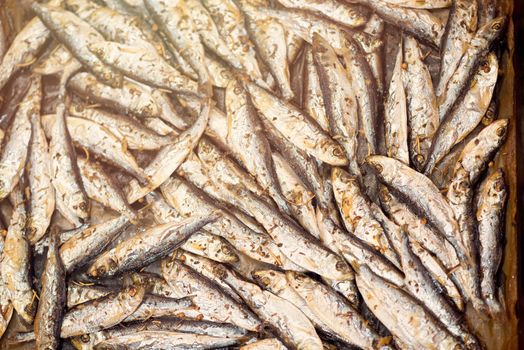 Fresh crispy fried Smelts in the pan. Close-up.