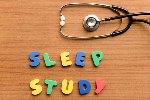 Sleep study colorful word on the wooden background