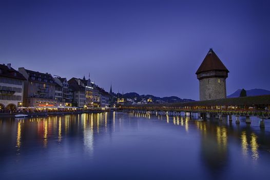 Night sight of Chapel Bridge in Lucerne, Switzerland and sky blue