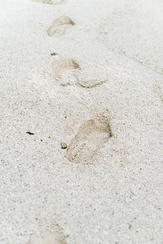 sand footprints, pacific ocean surf, tropical beach, Kauai, Hawaii