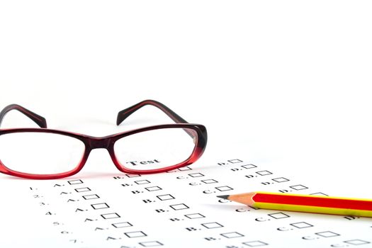 The test list and pencil and glasses  on the examination 