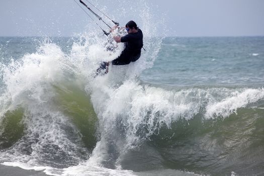 Kiteboarder enjoy surfing in ocean. Vietnam