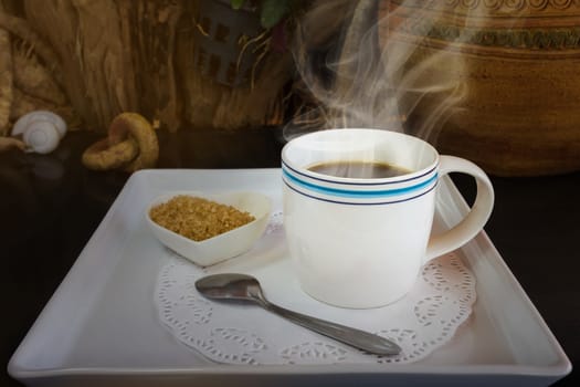 Big white cup of hot black coffee with sugar in still-life colour tone, classic simply black coffee on white tray