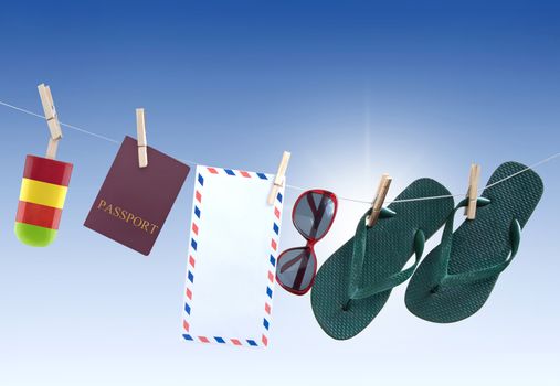 Summer items hanging on a washing line including passport, flip flops, sunglasses, frozen lolly and international mailing envelope