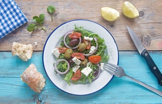 Freshly made greek salad with feta cheese and tomatoes