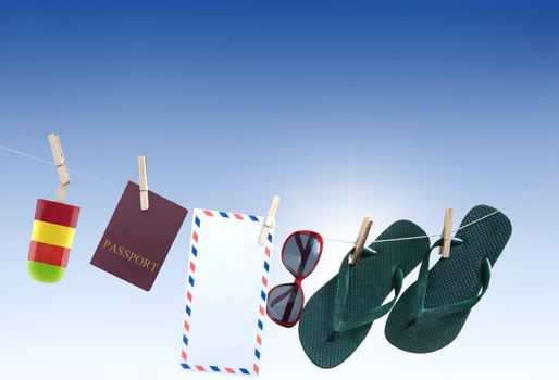 Summer items hanging on a washing line including passport, flip flops, sunglasses, frozen lolly and international mailing envelope