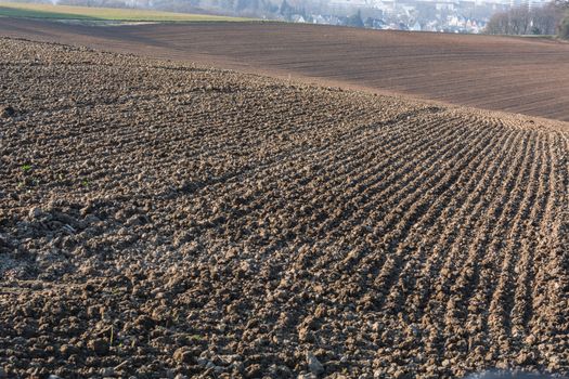 Freshly plowed field, field in Germany.