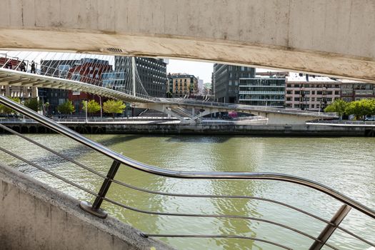 Bilbao, Vizcaya/Spain – 06/16/2016: Perspective Calatrava or Zubizuri Bridge on the River Nervion in Bilbao