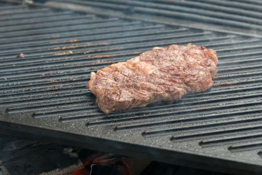 Two t-bone florentine beef steaks on the grill