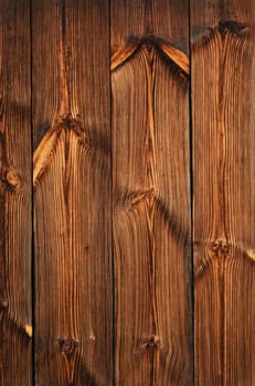 Brown vintage old wooden panel texture background with vertical unpainted aged planks and gaps 