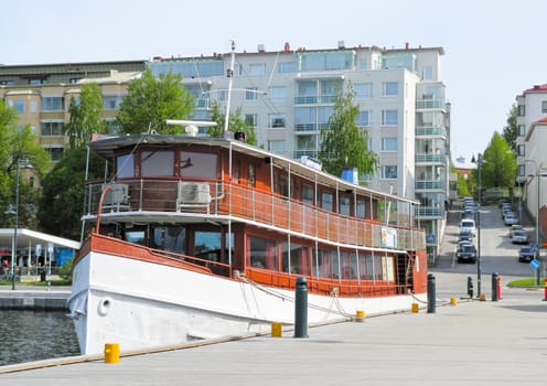 the ship berthed on the background of the urban landscape