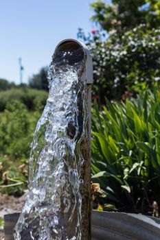 Water flowing from a well pipe