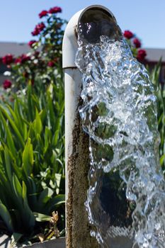 Water flowing from a well pipe