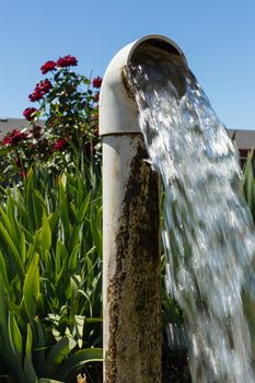 Water flowing from a well pipe