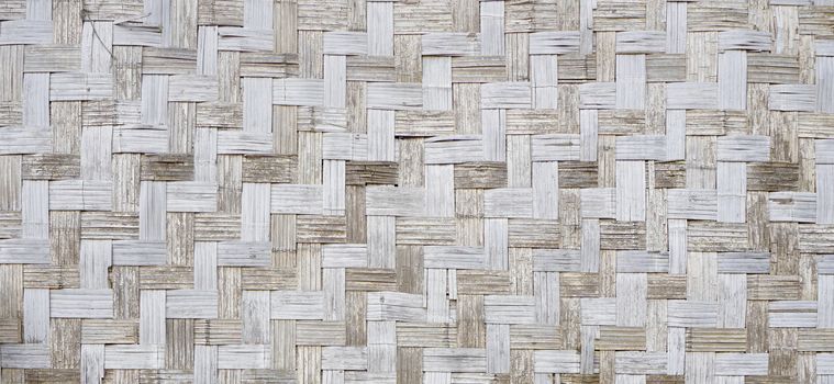 Wall of plaited bamboo strips square vernecular outdoor texture wood material