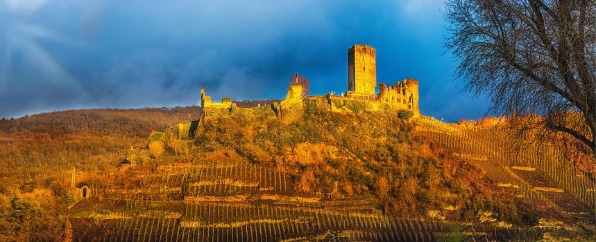 Artistic work of my own. HDR processing.  Old Postcard.
Panorama, Burg Metternich on the Mosel in Germany against a dramatic sky.