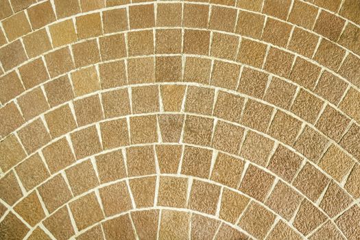 Close up circular brown brick paving pattern