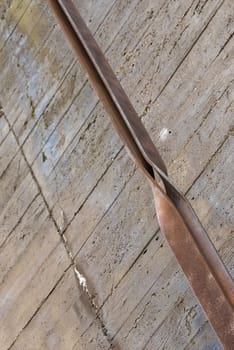 Industrial rusted steel strip and concrete as a background picture
