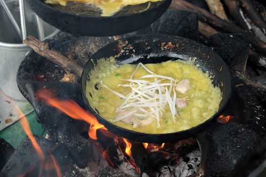 Vietnam food, banh xeo or vietnamese pancake make from rice flour and filled with a shrimp, meat, soya bean sprouts, is popular Viet Nam street food