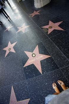 Hollywood, California, United States - September 18, 2011: A person walks along the Hollywood Walk of Fame.