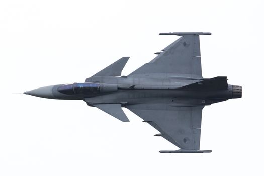 LEEUWARDEN, THE NETHERLANDS-JUNE 10: Modern tactical fighter jet JAS-39 Gripen performs at the Dutch Airshow on June 10, 2016 at Leeuwarden Airfield, The Netherlands.