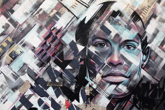 Larnaca, Cyprus - May 23, 2016: Graffiti with the image of the city and faces on the wall as a background in Larnaca, Cyprus