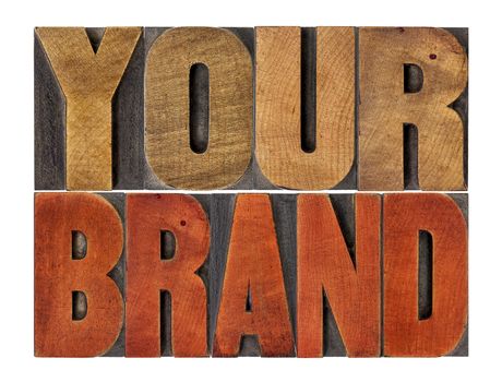 your brand word abstract- motivational concept in vintage letterpress wood type block