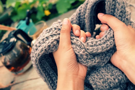 Knit man scarf for cold day in winter, hobby leisure with handmade gift for father day, woman hand knitting from yarn, nice present in vintage color