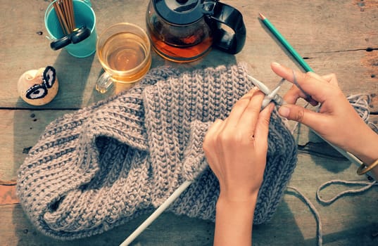 Knit man scarf for cold day in winter, hobby leisure with handmade gift for father day, woman hand knitting from yarn, nice present in vintage color