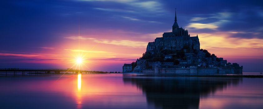 Panoramic view of Mont-Saint-Michel at sunset, France.