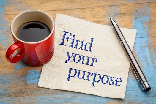 Find your purpose advice or reminder - handwriting on a napkin with a cup of espresso coffee