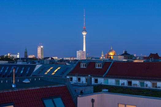 Berlin skyline with Fernsehturm (TV Tower), Neue Synagogue, and townhomes