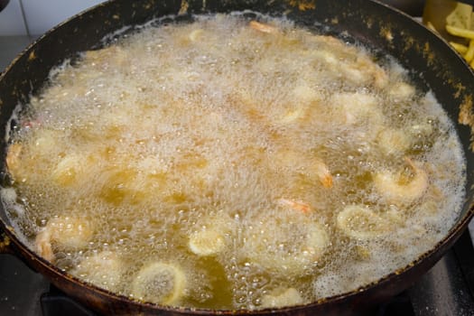 mixed fried fish, with squid, blue fish, chips and lemon