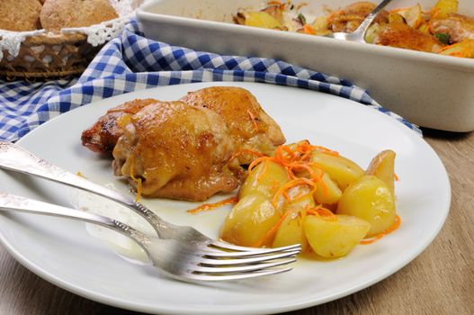 portion fried pieces  chicken with boiled potatoes and carrots 