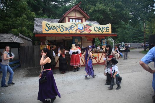 Concession booth and patrons at the New York Renaissance Faire Festival.