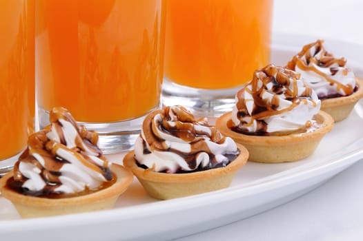 Shortbread сakes filled jam with whipped cream and chocolate, caramel topping
