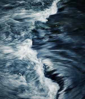 abstract dark background detail on the rapids of the river