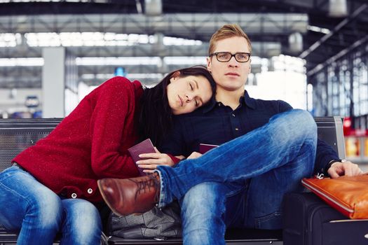 Couple waiting for flight at the airport