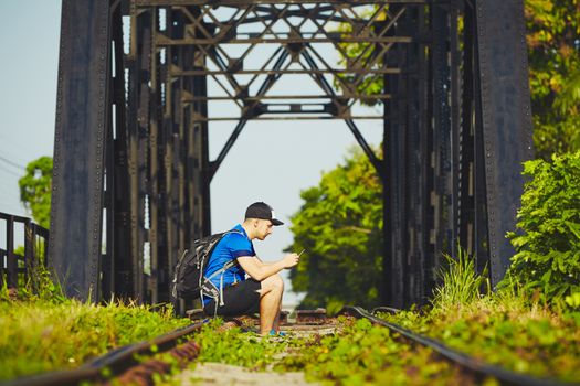 Young traveler with mobil phone traveling in Asia 