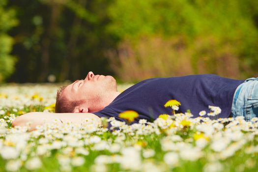 Handsome young man is enjoying sunny day