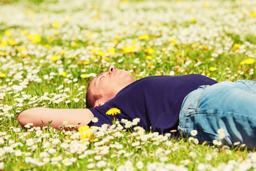 Handsome young man is enjoying sunny day