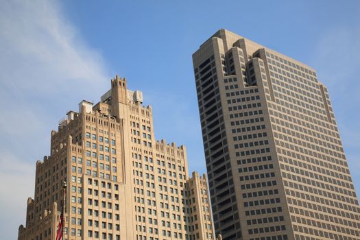 Buildings of St. Louis, Missouri, city rise into a bright blue sky.