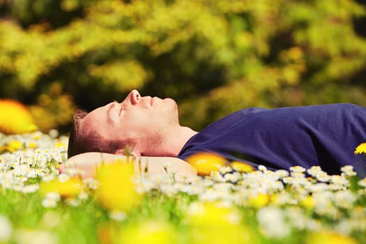 Handsome young man is enjoying sunny day