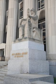 Mel Carnahan Courthouse. Constitution and torch statue at the former Federal Courthouse in St. Louis, Missouri. The building was constructed in 1935 with allegorical figures.
