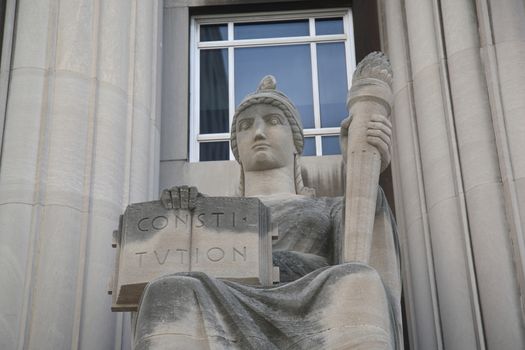 Mel Carnahan Courthouse. Constitution and torch statue at the former Federal Courthouse in St. Louis, Missouri. The building was constructed in 1935 with allegorical figures.