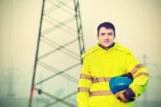 Worker wearing reflective clothing with helmet.