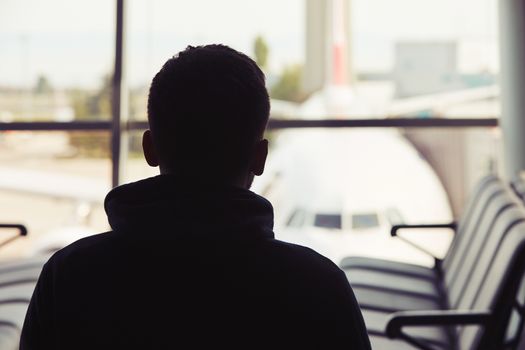 Young traveler is waiting at the airport