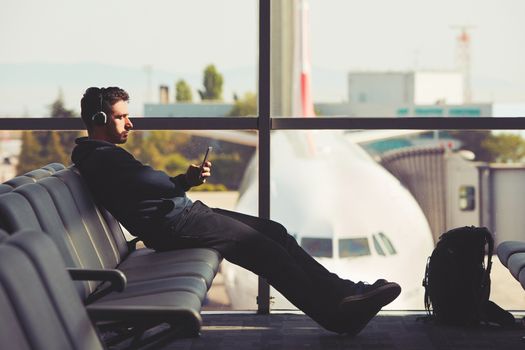 Young traveler is waiting at the airport