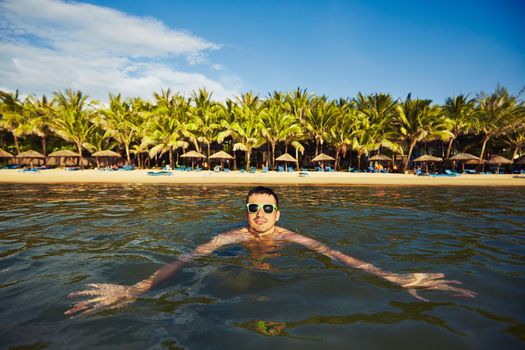 Young tourist is swimming in the sea - Vietnam