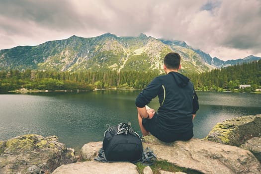 Young traveler is relaxing in the mountains